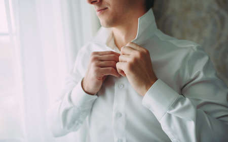 morning wedding preparations of a stylish groomの写真素材