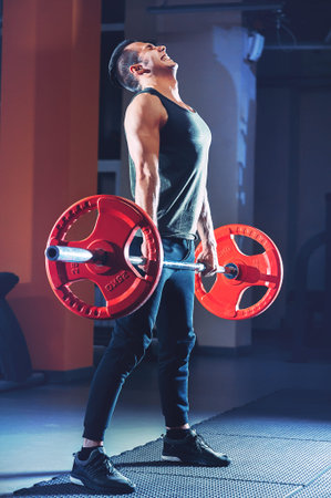 The athlete lifted a red bar, emotions, tension