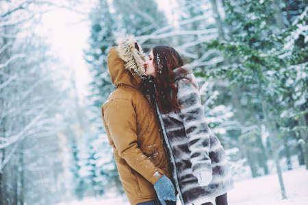 couple in love in the winter forestの写真素材