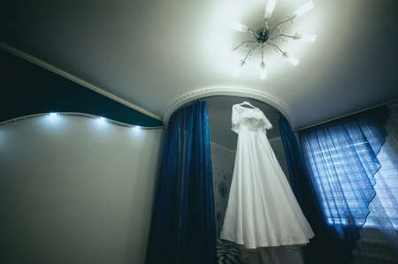 beautiful white wedding dress on hanger. wedding accessoriesの写真素材