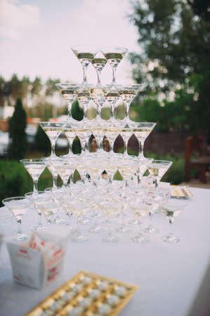Champagne glasses. Wedding slide champagne for bride and groom.の写真素材