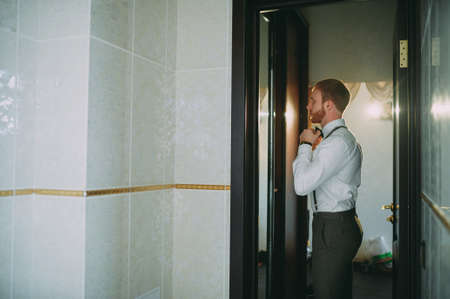 Groom preparing for the wedding. Future husband is waiting for his future wifeの写真素材
