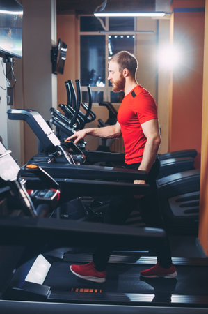 the athlete runs on a treadmill in the gym