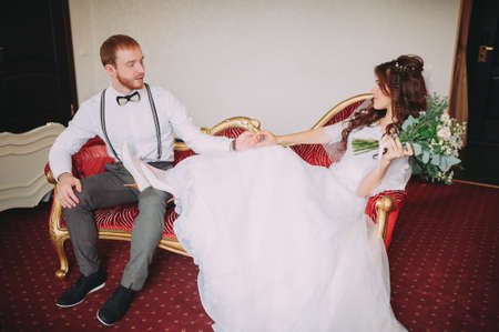 The bride and groom in hotel roomの写真素材