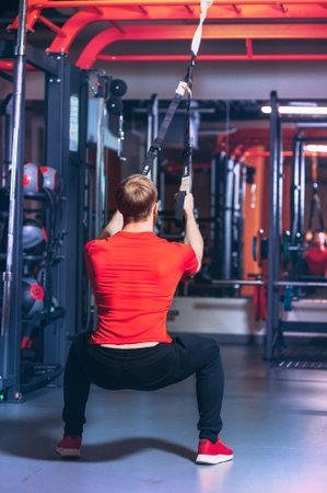 an athlete is engaged in a sports simulator in the gym