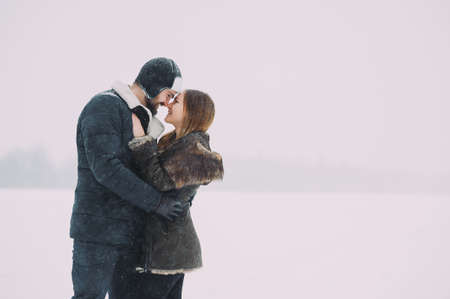 beautiful couple in love on the background of the winter sky. isolatedの写真素材