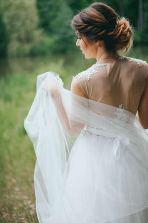 Beautiful bride posing in her wedding dayの写真素材