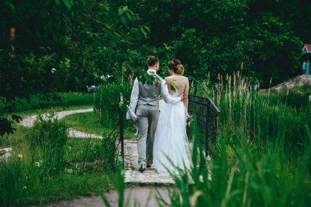 the bride and groom posing for a wedding walk. rustic wedding concept