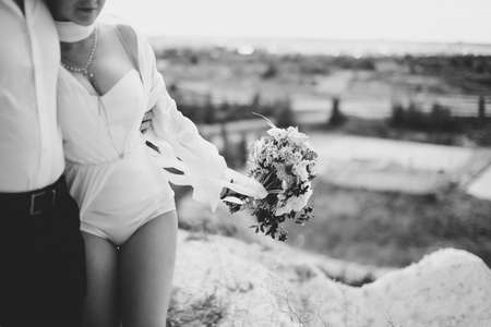 bride and groom walking outdoors at the weddingの写真素材