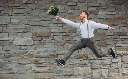 Happiness jump of bride and groom on the beach