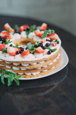 fruit cake with strawberries mint and blueberryの写真素材