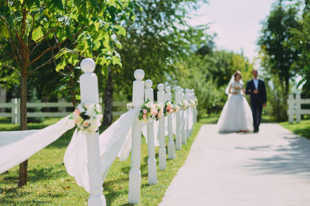 Guests Throwing Confetti Over Bride And Groom At Weddingの写真素材