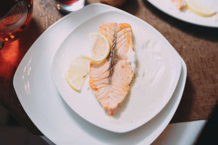 hot dish with meat, restaurant, white plate. red fishの写真素材