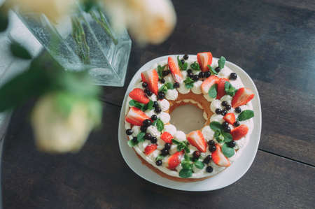 beautiful almond cake with fruit. strawberry, blueberry, mintの写真素材