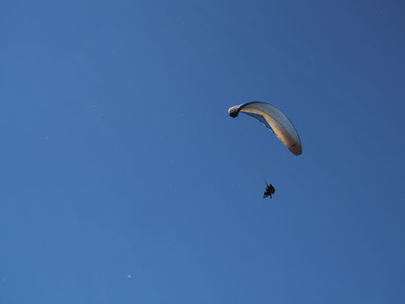 paragliders against the blue sky and mountains