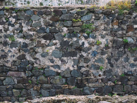 stone wall texture with cracks and patterns on the surfaceの写真素材