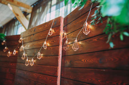Wedding decor. Flashlights. Newlyweds table. Fresh flowers, candlesの写真素材