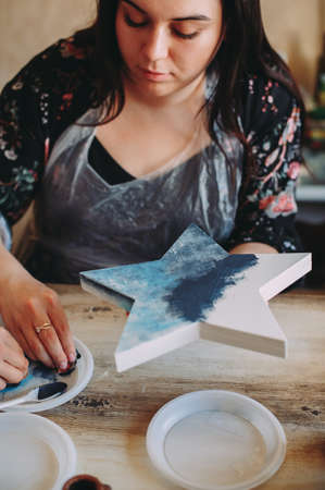 master class on creativity. girl makes a frameの写真素材