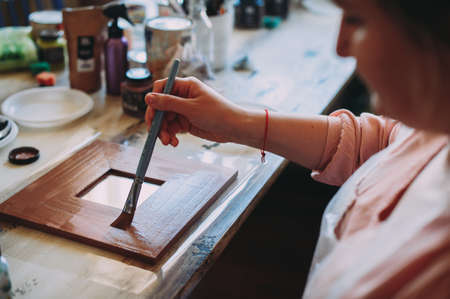 master class on creativity. girl makes a frameの写真素材