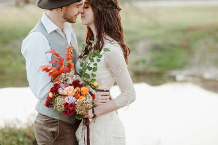 bride and groom on the background of the lake. wedding walkの写真素材