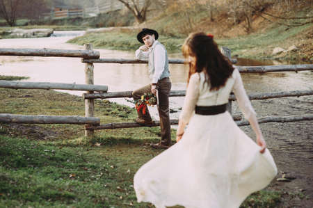 wedding photo session of the bride and groom on the background of the river. natural Parkの写真素材