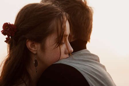 beautiful romantic couple at sunset close-up. love. emotions. parting. frame from the movie. book coverの写真素材