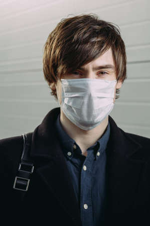 Guy in a protective medical mask. coronavirus. epidemic. virus protection.の写真素材