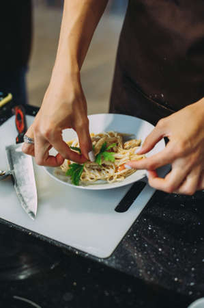 culinary master class on cooking pasta with musselsの写真素材