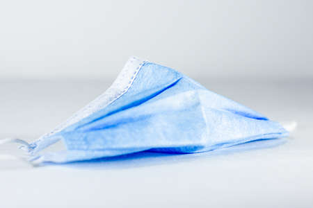 Medical mask against corona virus background mockup. Surgical protective mask closeup on white background.の写真素材