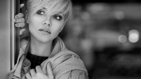 young blonde woman portrait in autumn color.の写真素材