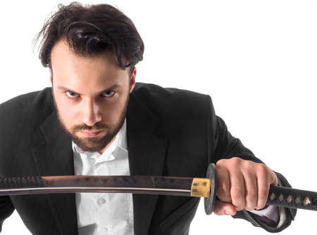 Close-up Of Businessman with Sword Over White Background