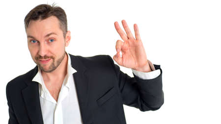 Smiling businessman making alright signの写真素材