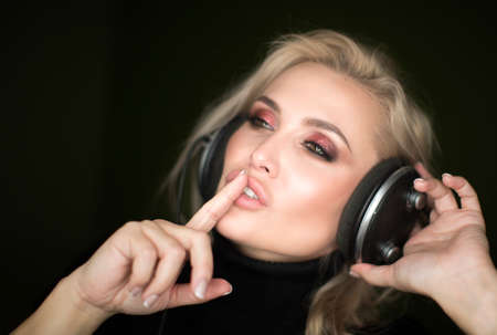 Beautiful natural emotional young woman listening the musicの写真素材