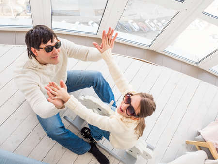 children and people concept - happy father and child girl having fun