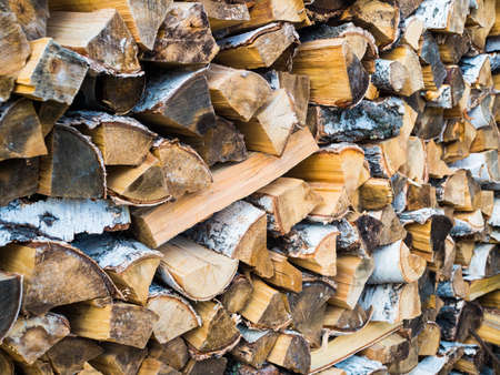 Stacked Logs Texture, Natural Background. Cross section of the timber, firewood stack for the background.の写真素材