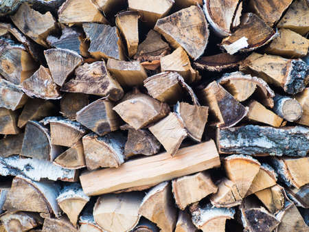 dry chopped firewood logs ready for winter.
