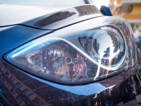 close up of car head light. Left headlamp of a carの写真素材