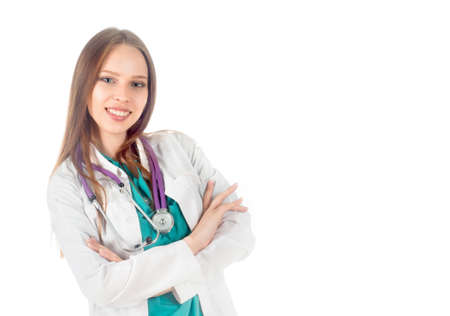 smiling doctor woman with stethoscope standing isolated on white backgroundの写真素材