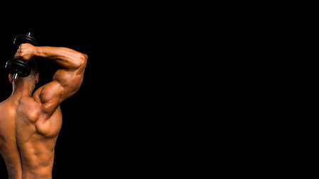 Handsome power athletic man training pumping up muscles with sport equipment. Strong bodybuilder...