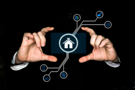 mens hands hold a virtual mortgage lending schemeの写真素材