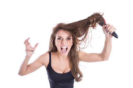 The girl who combing their hair. Hair care conceptの写真素材