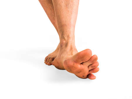 close up view of a dirty human foot on a white background
