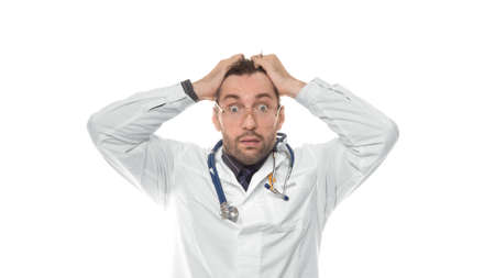 Shocked Doctor over white background. Shocked doctor in eyeglass, medical professional in shock with...