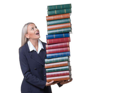 Smiley businesswoman or lawer holding a lot of books. Isolated on white backgroundの写真素材