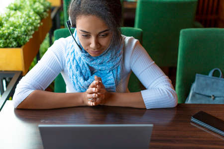 Afro-famerican girl during an online conversation.