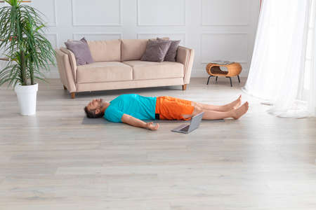 Relaxation and mental health. Relaxation practice with online tutorial. Shavasana.の写真素材