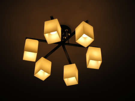 chandelier in a modern style, which is hanging on the ceilingの写真素材