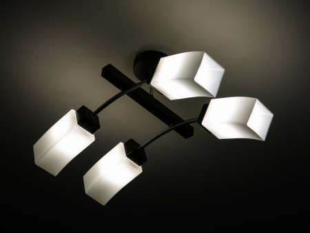 chandelier in a modern style, which is hanging on the ceilingの写真素材