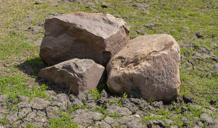 Pile of large stones on green grassの写真素材