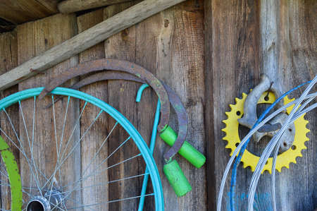 Old things hanging on the wall of unpainted wooden boardsの写真素材